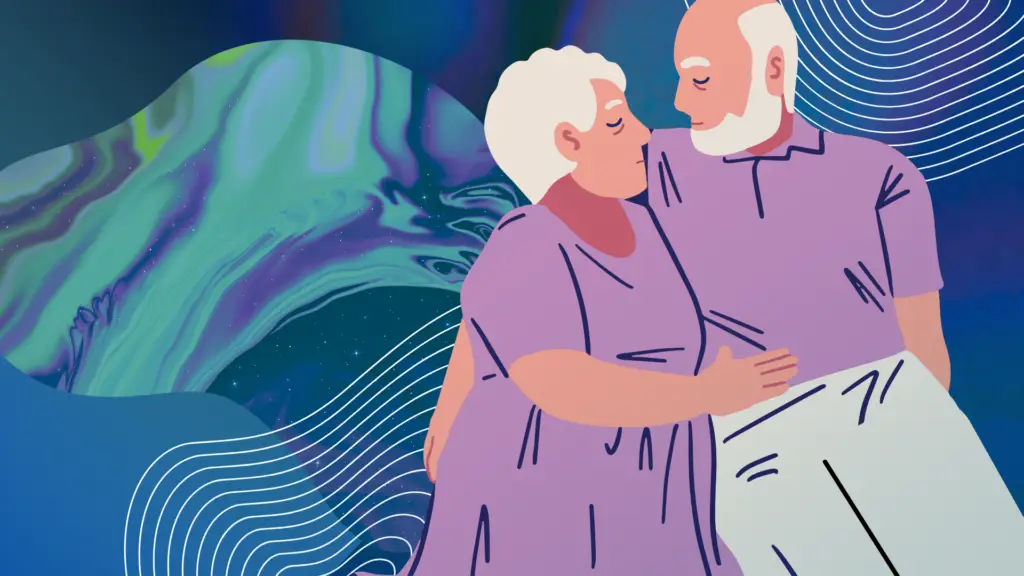 A senior couple hold each other against a serene blue background.